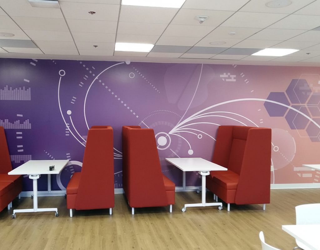 Modern breakroom wall mural with purple gradient and geometric hexagon pattern installed by American Window Film