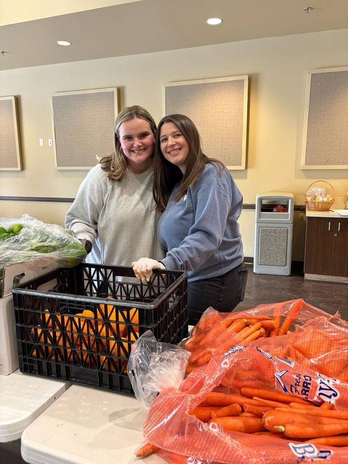 Teammates volunteering at a food bank