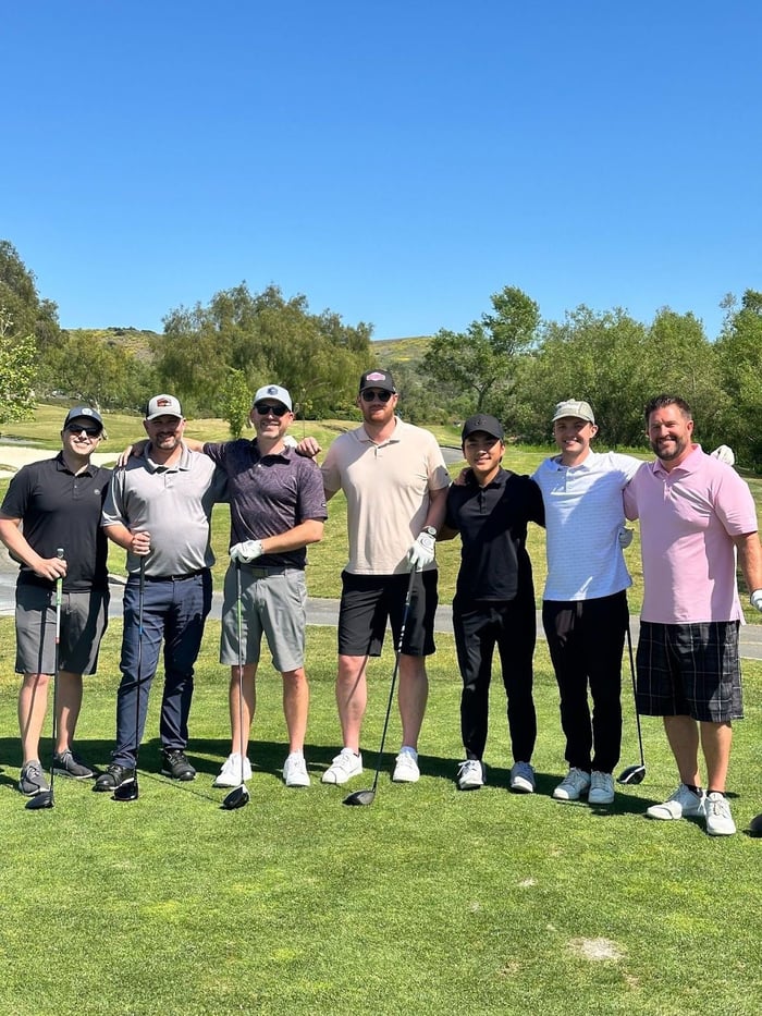 Teammates on a We Not Me golf outing