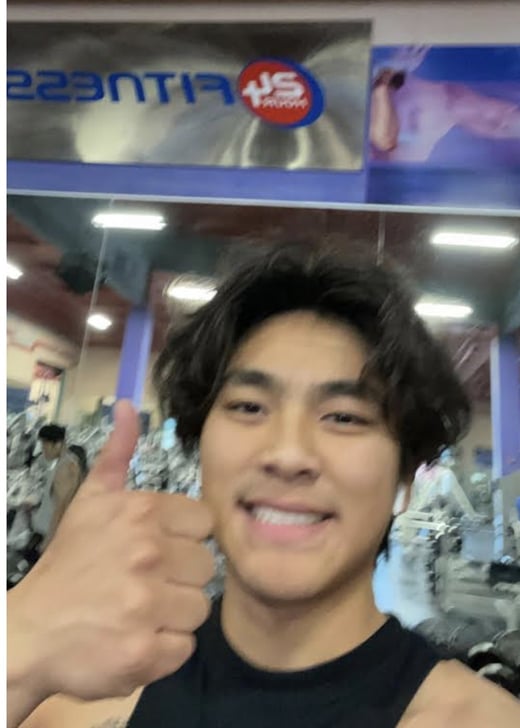 A teammate at the gym on the wellness perk