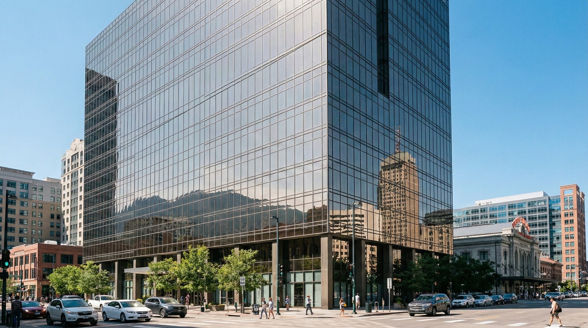 Commercial window tinting on a modern Denver office building in bright daylight. Commercial window tinting on a modern Denver office building in bright daylight.