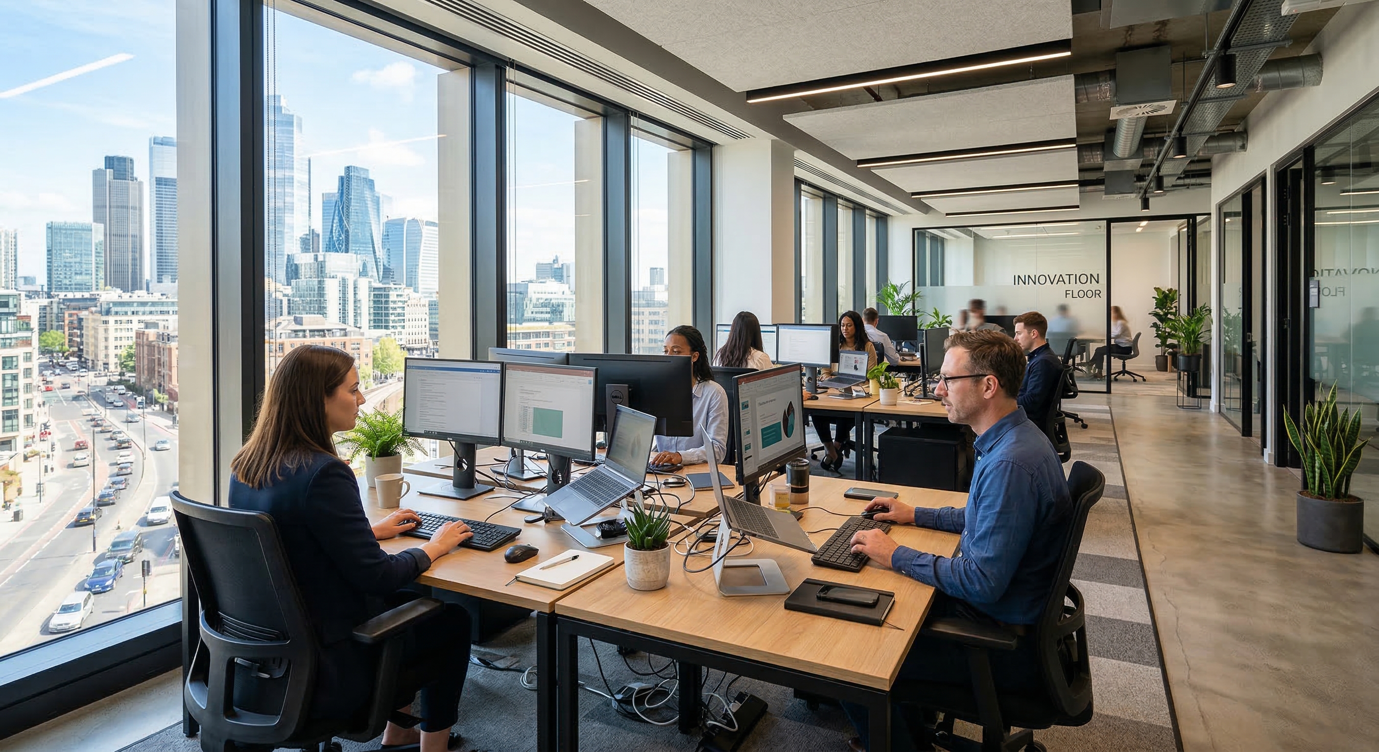 office workstations located near large windows in a commercial building