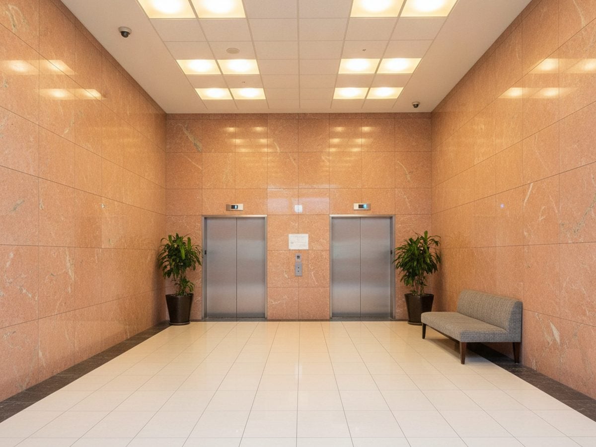 Worn reception desk in a Tempe, AZ office before 3M DI-NOC architectural film